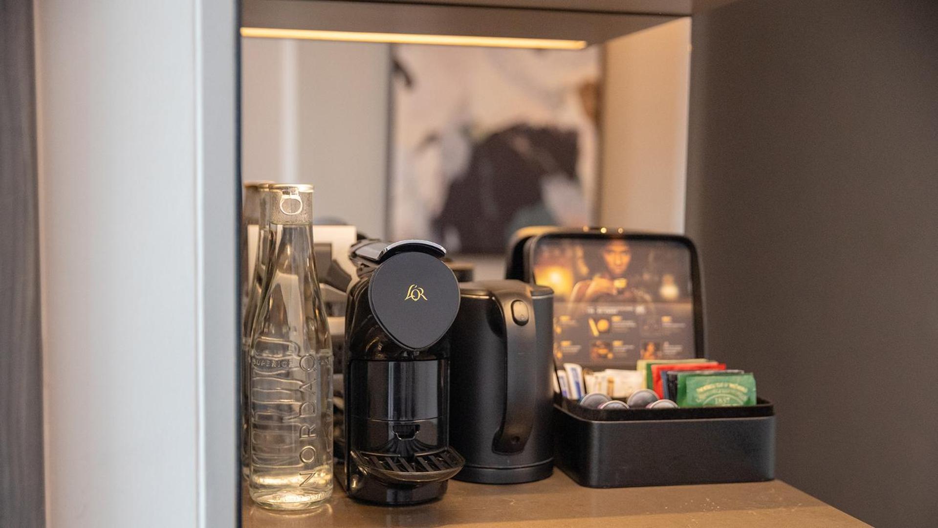 Chatrium Grand Bangkok Exterior foto A Nespresso coffee machine in a hotel room